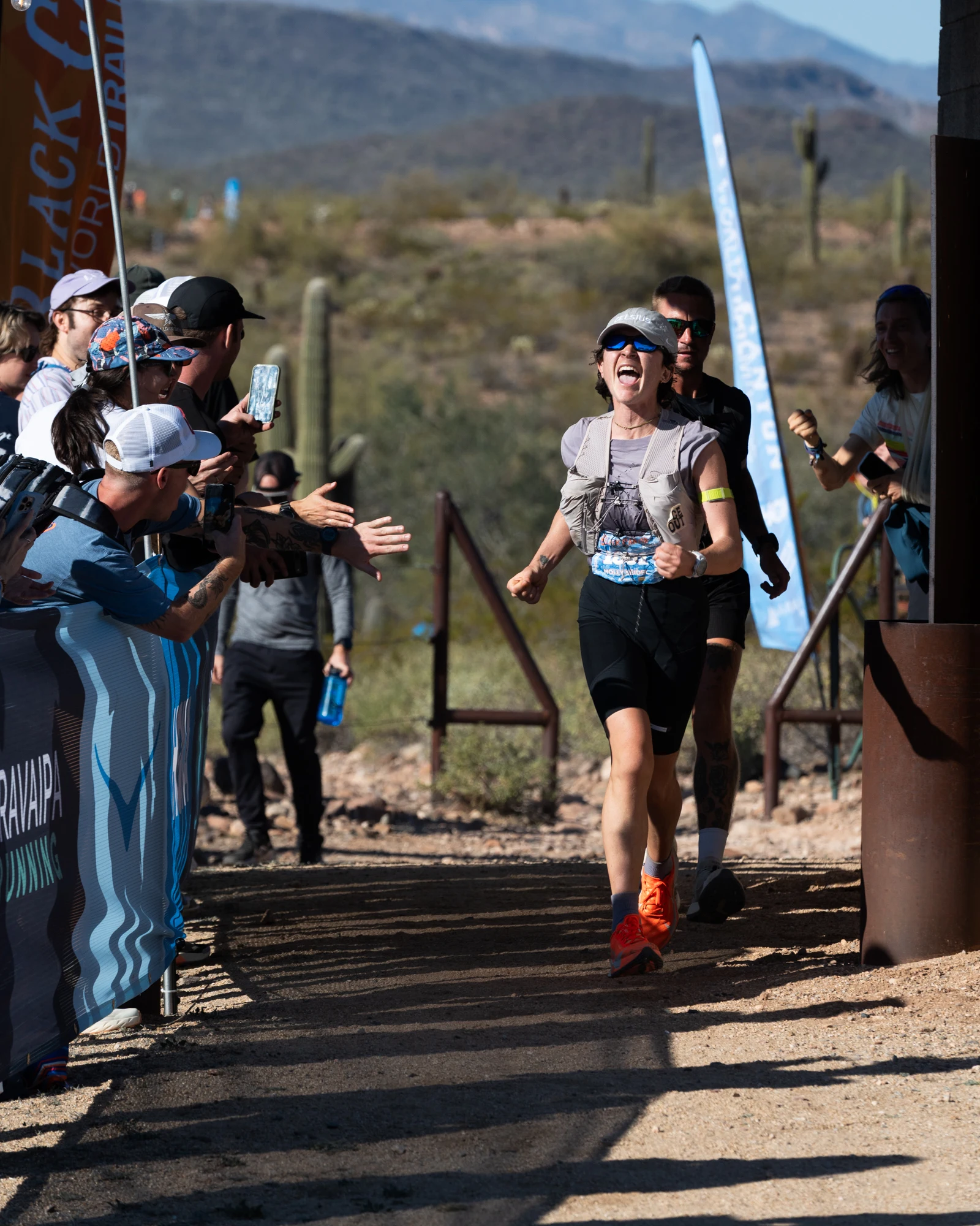 Molly Seidel smiles as she runs into the finish chute at Black Canyon 100K.
