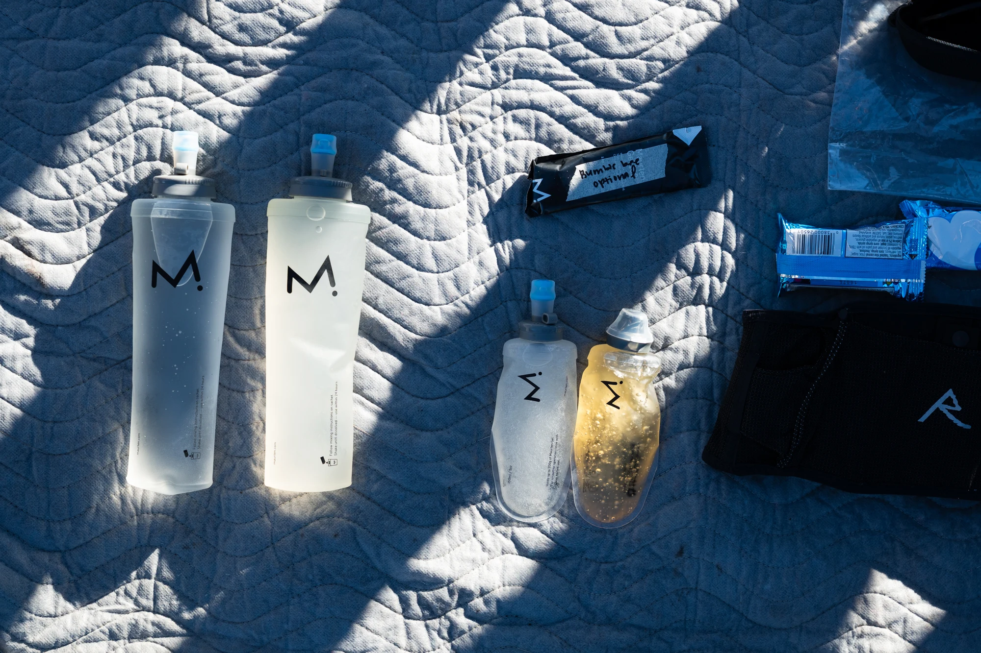 Hydration bottles and race nutrition are arranged for Molly Seidel's race.