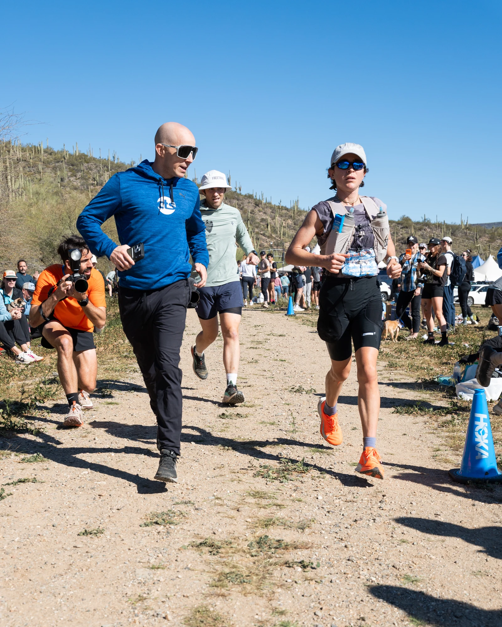 Molly Seidel reaches a crowded aid station during Black Canyon 100K.