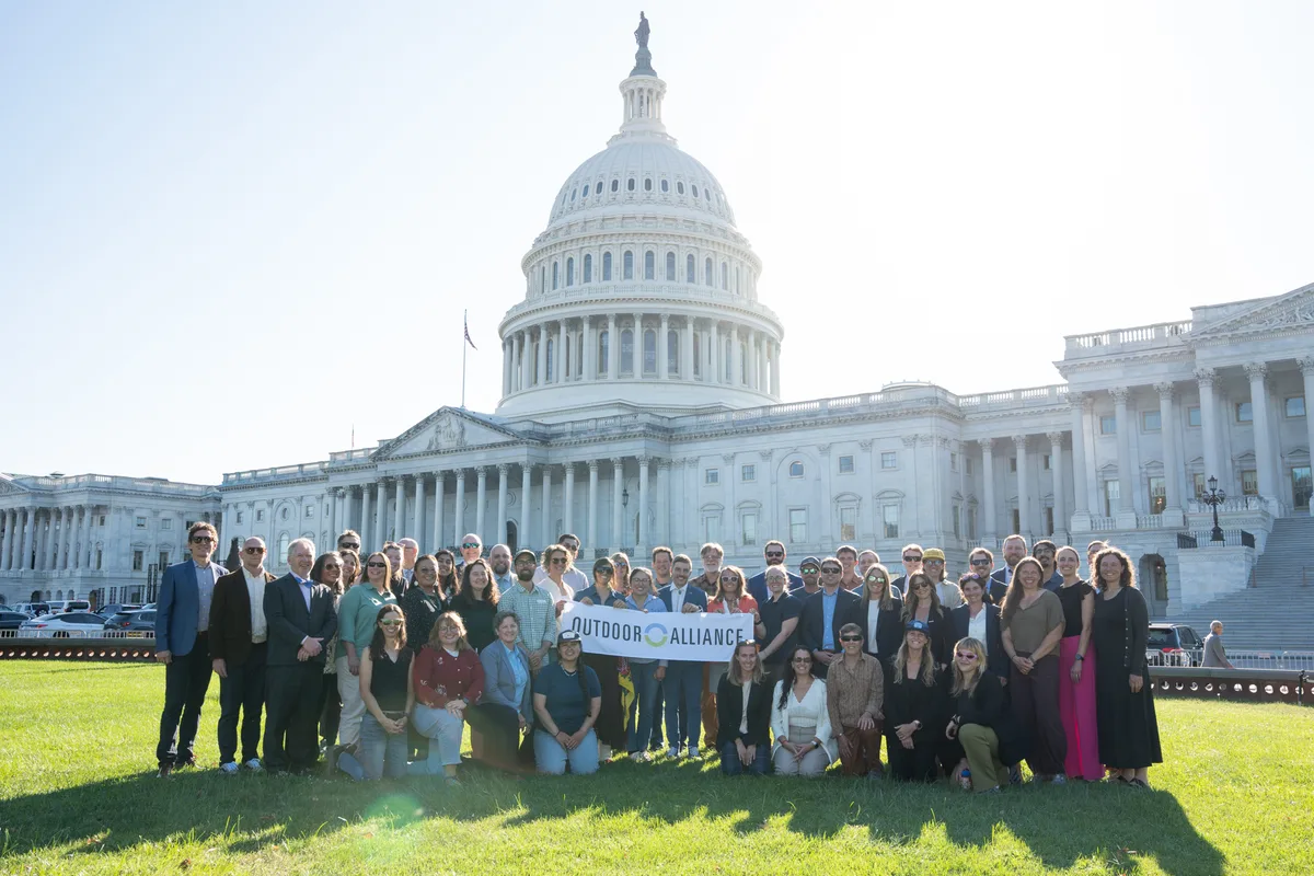 Outdoor Alliance fly-in participants gather for a group photograph outside the United States Capitol.